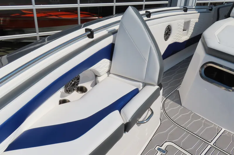 Slide: The Image of 2021 Sunsation 34 CCX boat interior with white and blue seating, modern design. - 14