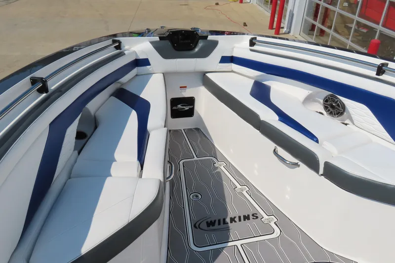 Slide: The Image of 2021 Sunsation 34 CCX boat interior with blue and white seating and custom flooring. - 15