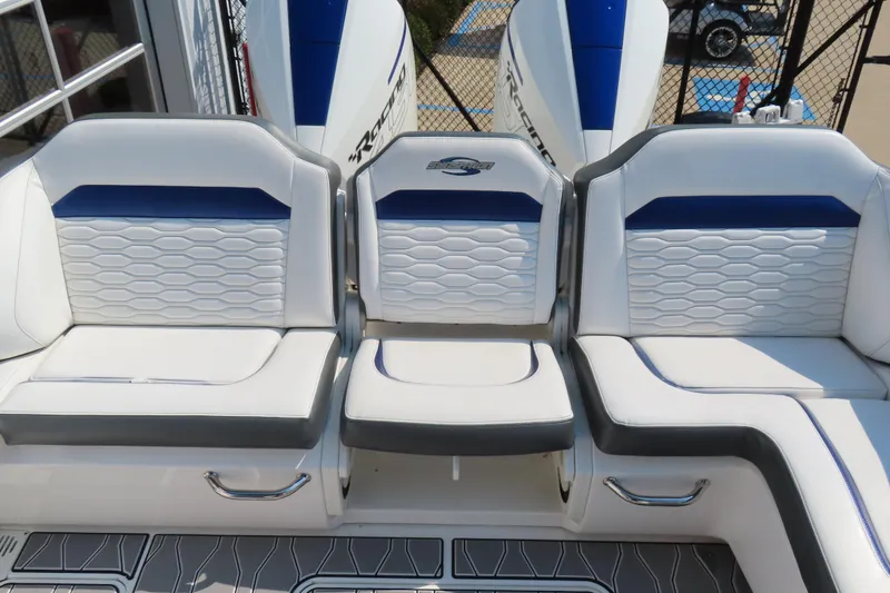 Slide: The Image of 2021 Sunsation 34 CCX boat seating with white and blue upholstery, featuring modern design. - 21