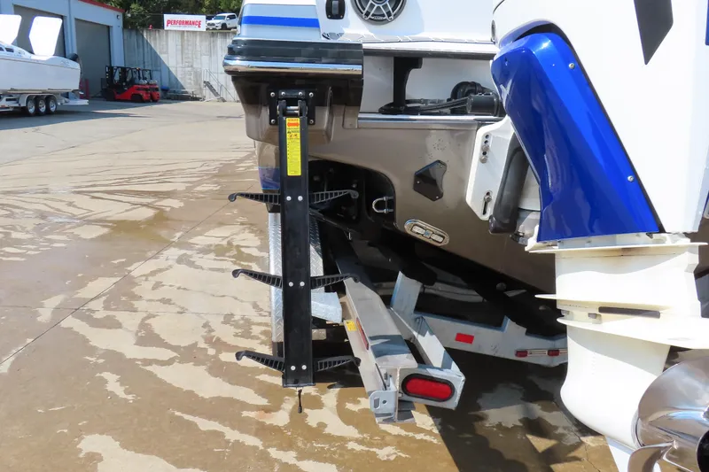 Slide: The Image of 2021 Sunsation 34 CCX boat rear view with ladder and motor details. - 6