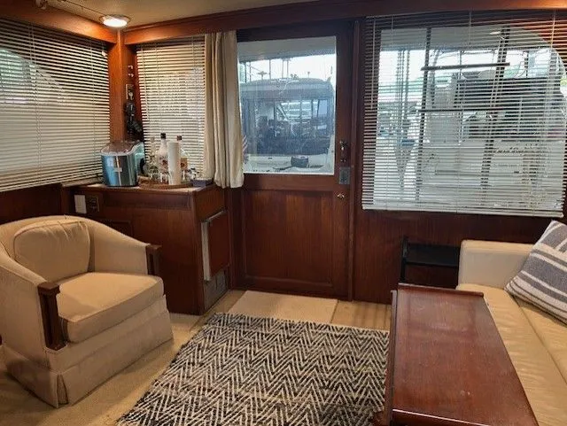 Slide: The Image of Interior of 1984 Post 43 Sport Fisherman yacht with cozy seating and wooden accents. - 11