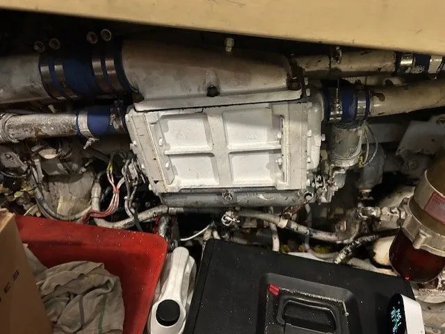 Slide: The Image of Engine compartment of 1984 Post 43 Sport Fisherman boat, showing mechanical components and wiring. - 18