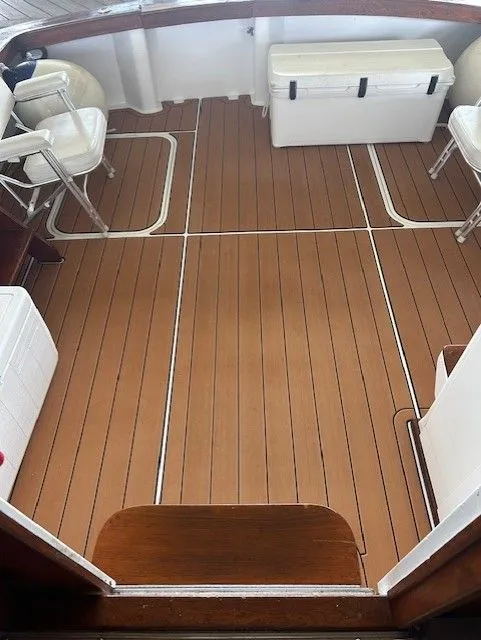 Slide: The Image of 1984 Post 43 Sport Fisherman boat deck with seating and storage. - 5