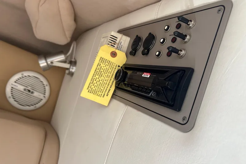 Slide: The Image of Control panel with switches and Sony stereo on a 2001 Cobalt 227 boat interior. - 11
