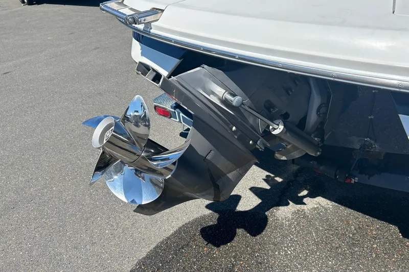 Slide: The Image of Rear view of a 2001 Cobalt 227 boat with a shiny propeller. - 18