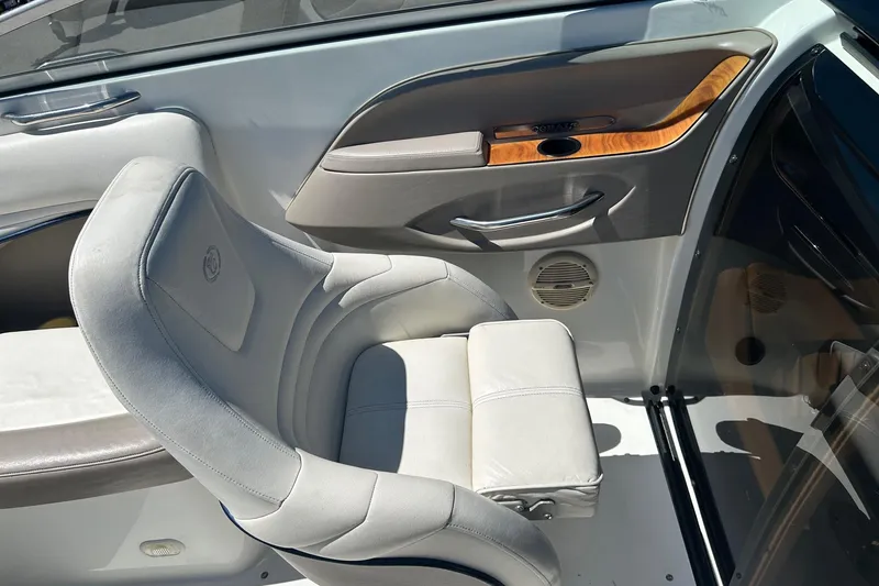Slide: The Image of Luxurious interior of a 2001 Cobalt 227 boat featuring plush seating and wood accents. - 5