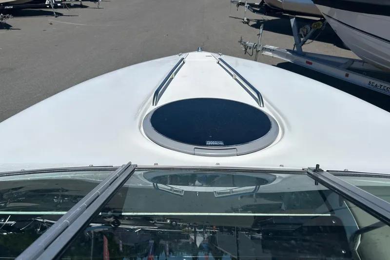 Slide: The Image of Bow view of a 2001 Cobalt 227 boat with a circular hatch. - 6