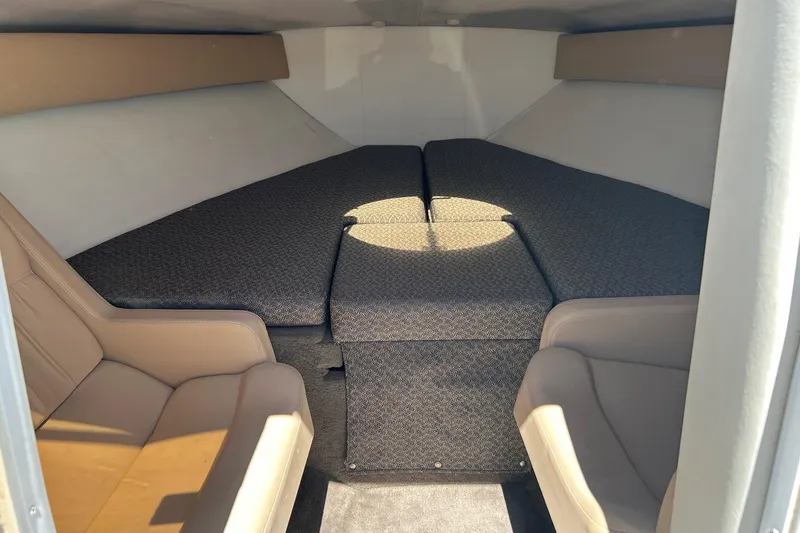 Slide: The Image of Interior cabin of a 2001 Cobalt 227 boat with cushioned seating. - 8