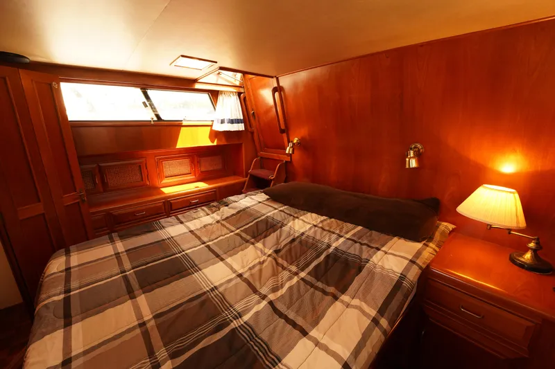 Slide: The Image of Cozy cabin interior of 1986 Ocean Alexander 40 Double Cabin yacht with wood paneling. - 23