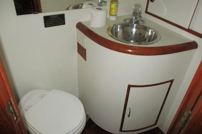 Slide: The Image of 1986 Ocean Alexander 40 Double Cabin bathroom with sink and toilet. - 30