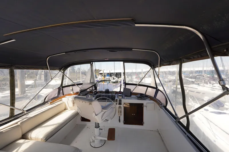 Slide: The Image of 1986 Ocean Alexander 40 Double Cabin yacht interior with helm and seating area. - 7
