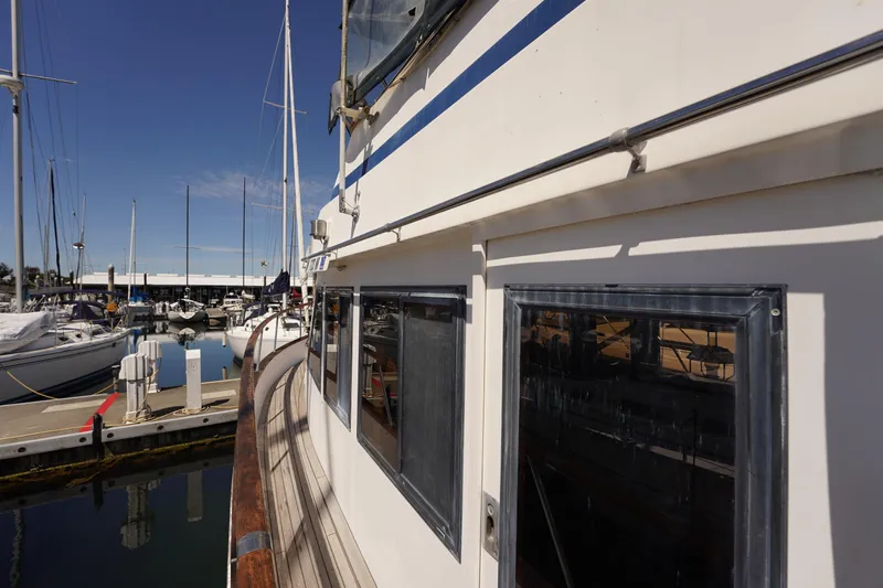 Slide: The Image of 1986 Ocean Alexander 40 Double Cabin yacht docked at marina, sunny day. - 11