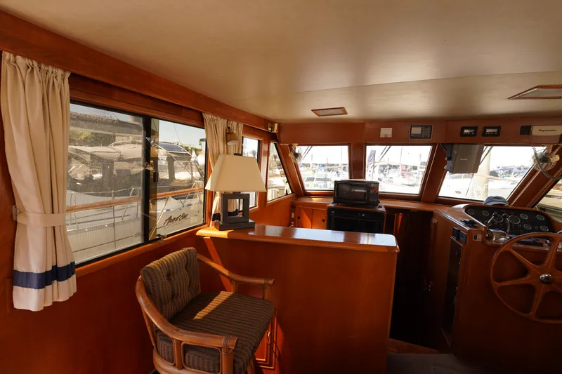 Slide: The Image of Interior of 1986 Ocean Alexander 40 Double Cabin yacht with helm and seating area. - 15