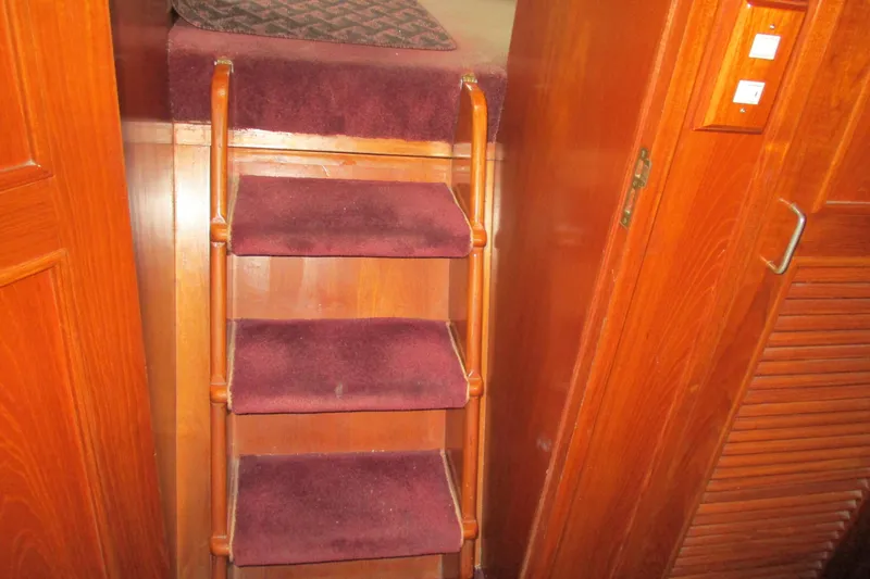 Slide: The Image of Interior of 1986 Ocean Alexander 40 Double Cabin with carpeted wooden stairs. - 27