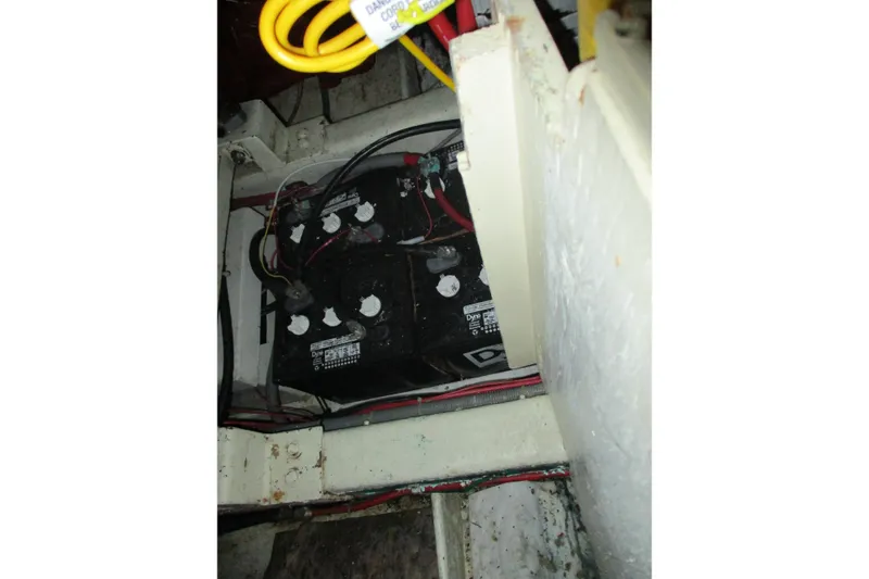 Slide: The Image of Battery compartment of 1986 Ocean Alexander 40 Double Cabin with wiring and connections. - 34