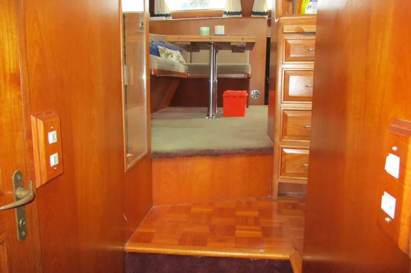 Slide: The Image of Interior of 1986 Ocean Alexander 40 Double Cabin with wooden furnishings. - 41