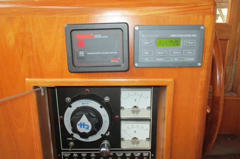 Slide: The Image of Control panel of 1986 Ocean Alexander 40 Double Cabin yacht with gauges and switches. - 44