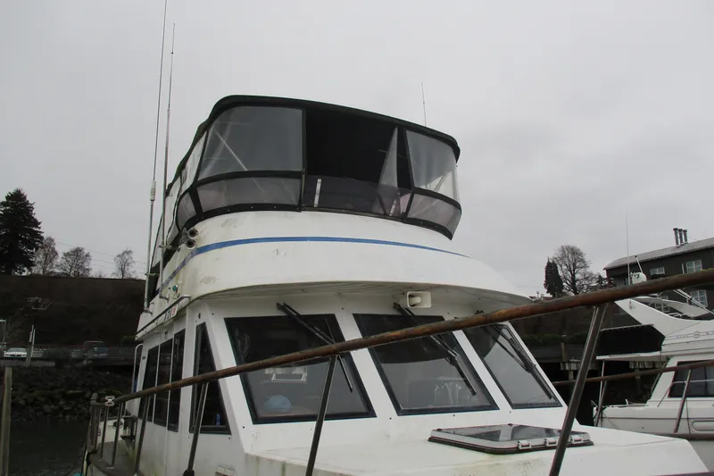 Slide: The Image of 1986 Ocean Alexander 40 Double Cabin yacht docked on a cloudy day. - 47