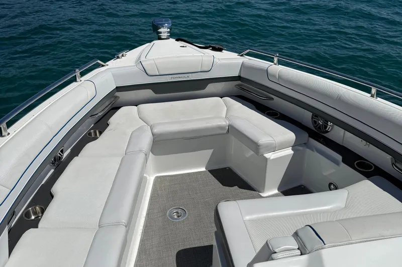 Slide: The Image of 2018 Formula 330 Crossover Bowrider interior with spacious seating on calm water. - 10