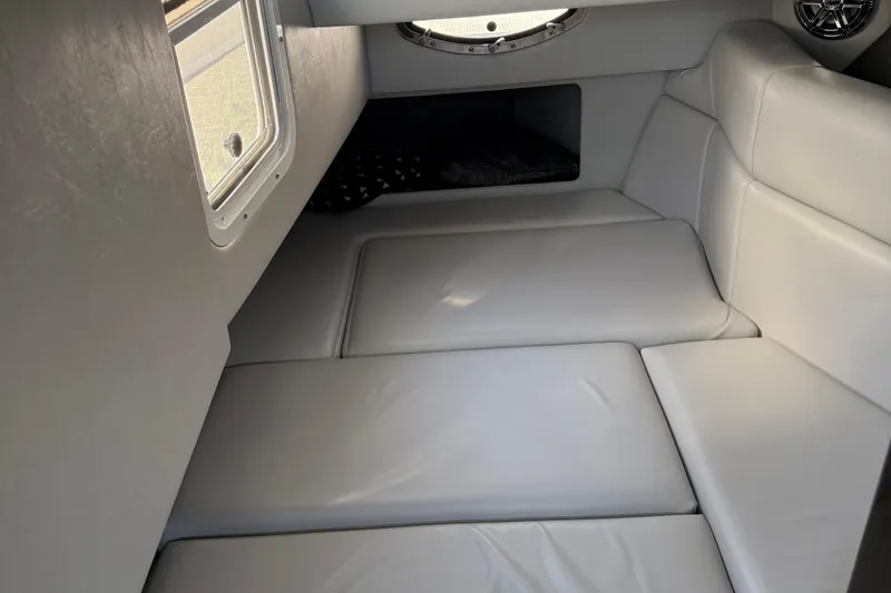 Slide: The Image of Interior cabin of 2018 Formula 330 Crossover Bowrider with white leather seating. - 11