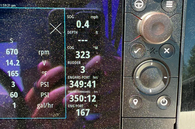 Slide: The Image of Close-up of a 2018 Formula 330 Crossover Bowrider dashboard display with navigation data. - 6