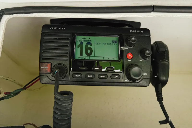 Slide: The Image of VHF radio on 2016 Robalo R222 Center Console, displaying channel 16 distress signal. - 12