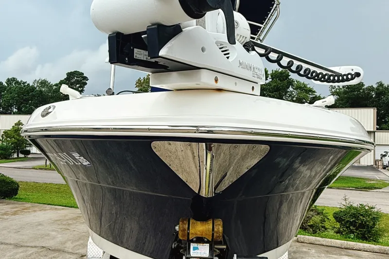 Slide: The Image of 2016 Robalo R222 Center Console boat front view with trolling motor. - 4