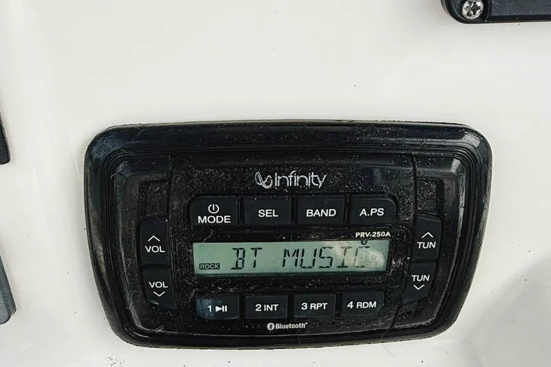 Slide: The Image of Infinity stereo system on 2016 Robalo R222 Center Console boat dashboard. - 7