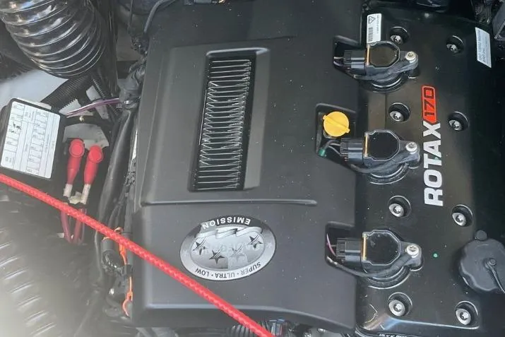 Slide: The Image of Engine of 2022 Scarab 215 SE with Rotax 170, showcasing components and wiring. - 16