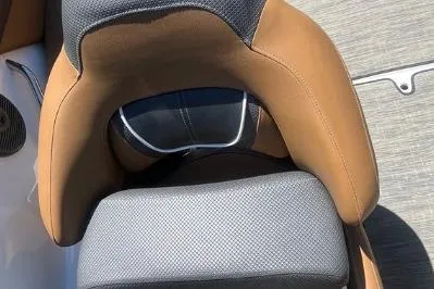 Slide: The Image of 2022 Scarab 215 SE boat seat with brown and black upholstery. - 24