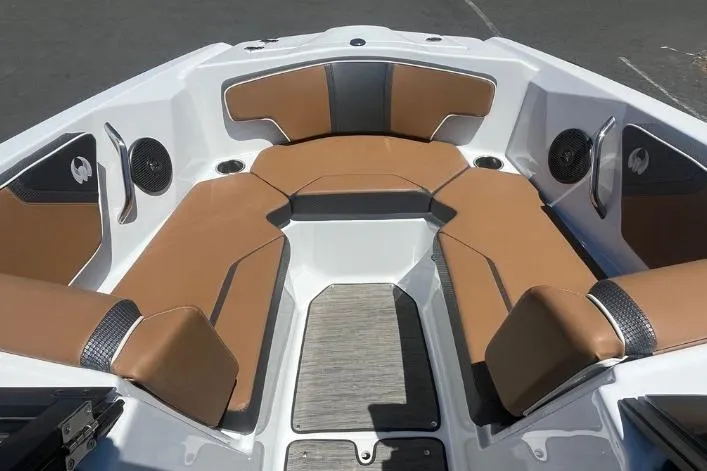 Slide: The Image of 2022 Scarab 215 SE boat interior with brown and gray seating, modern design. - 3