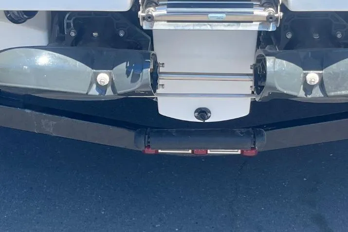 Slide: The Image of Rear view of 2022 Scarab 215 SE boat, showcasing dual exhaust and swim platform. - 8