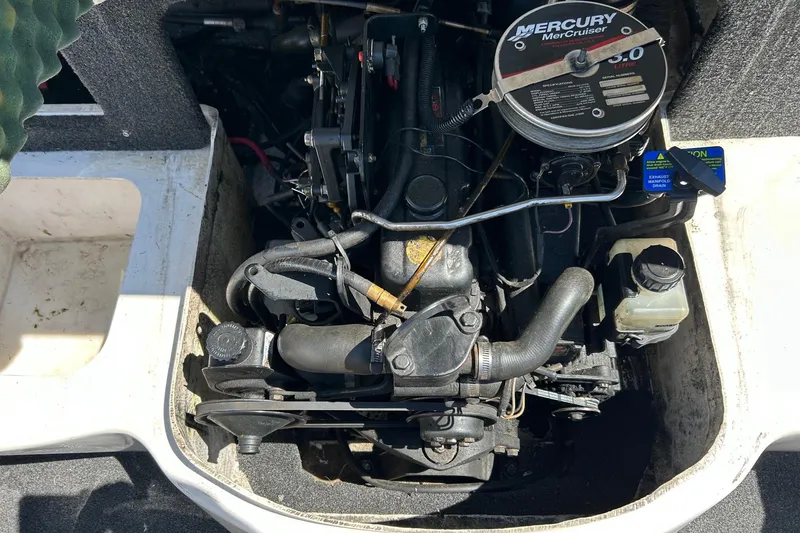 Slide: The Image of Engine compartment of a 2000 Sea Ray 185 Bow Rider with Mercury MerCruiser 3.0L engine. - 14