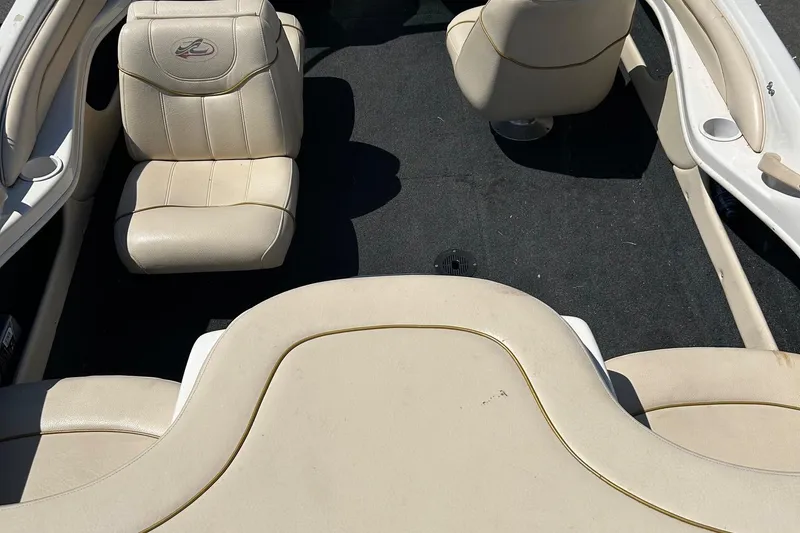 Slide: The Image of Interior of a 2000 Sea Ray 185 Bow Rider boat with beige seating. - 8