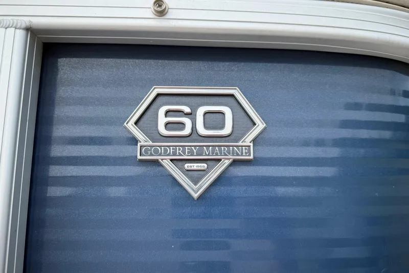 Slide: The Image of 2018 Sweetwater Sunrise 206 F trailer wheels on asphalt surface. - 26