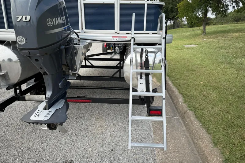 Slide: The Image of Close-up of a 2018 Sweetwater Sunrise 206 F trailer tire on asphalt. - 27