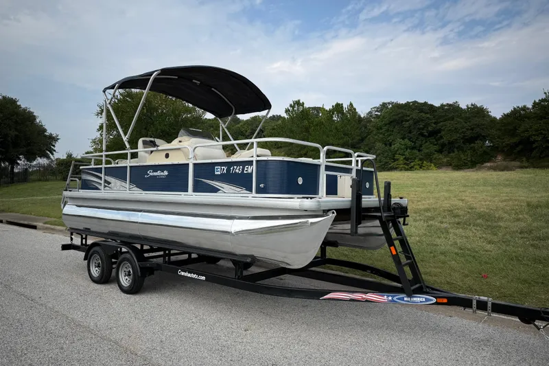 Slide: The Image of Reflection on Sweetwater Sunrise 206 F pontoon, 2018 model, with person in red shirt. - 29