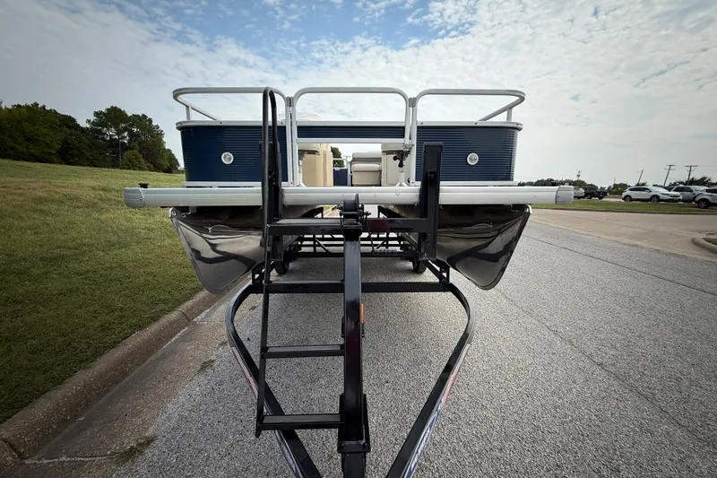 Slide: The Image of 2018 Sweetwater Sunrise 206 F pontoon boat on trailer by a lake. - 3