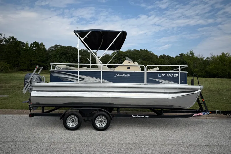 Slide: The Image of 2018 Sweetwater Sunrise 206 F pontoon boat with Yamaha 70 outboard motor on trailer. - 32