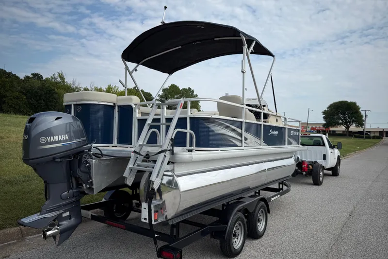 Slide: The Image of 2018 Sweetwater Sunrise 206 F boat with reflective surface showing distorted reflection. - 37
