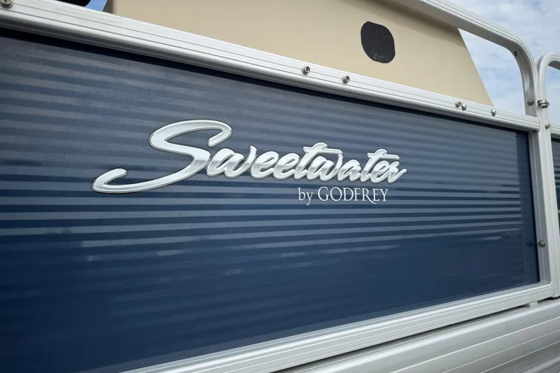 Slide: The Image of Godfrey Marine 60th anniversary emblem on 2018 Sweetwater Sunrise 206 F boat. - 41