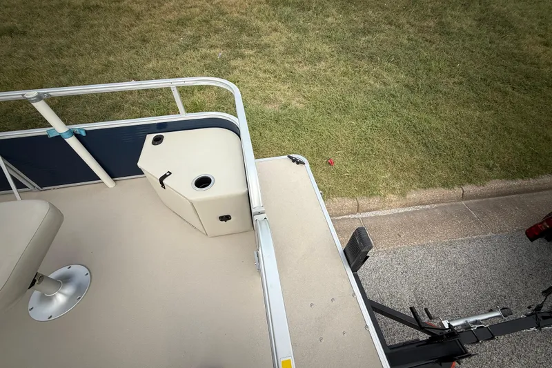 Slide: The Image of 2018 Sweetwater Sunrise 206 F pontoon boat on trailer, parked on roadside. - 44