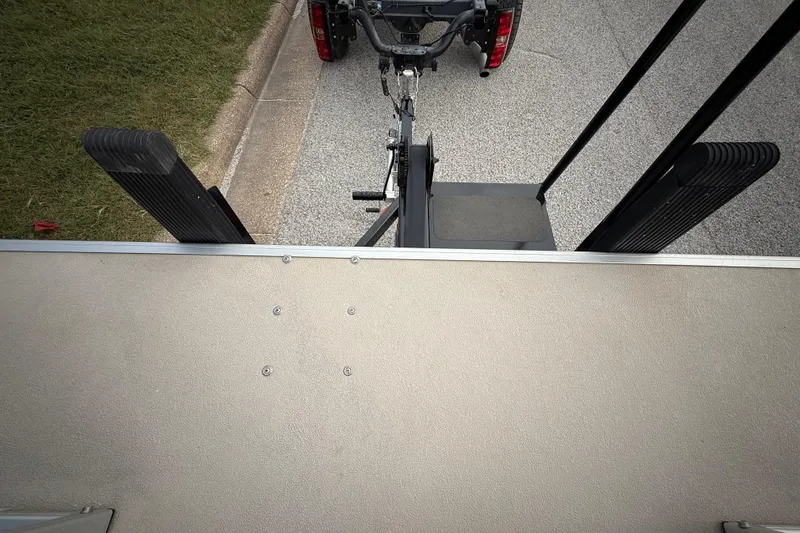 Slide: The Image of 2018 Sweetwater Sunrise 206 F pontoon boat on trailer, parked on roadside. - 46