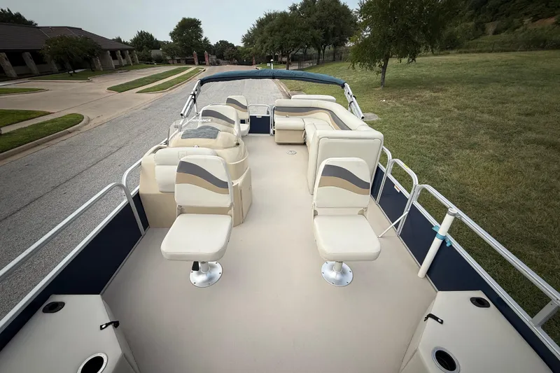 Slide: The Image of 2018 Sweetwater Sunrise 206 F pontoon boat on trailer, parked on roadside. - 47