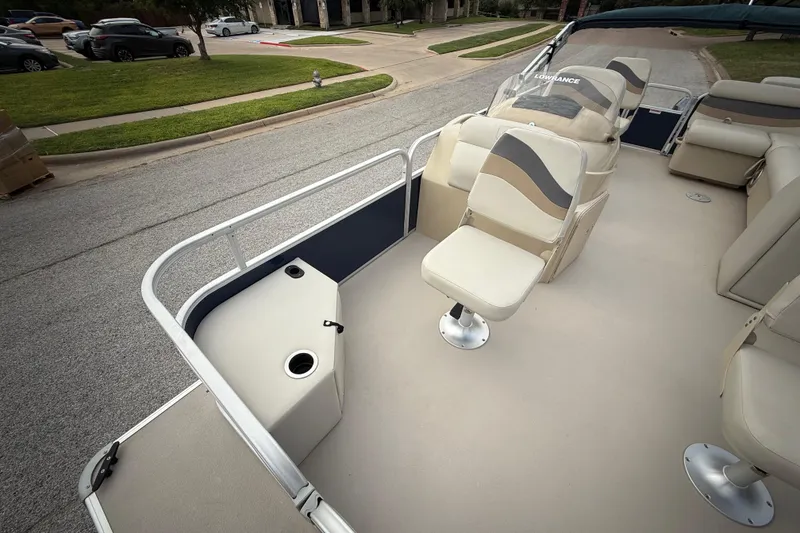 Slide: The Image of 2018 Sweetwater Sunrise 206 F pontoon boat on trailer, parked on roadside. - 48