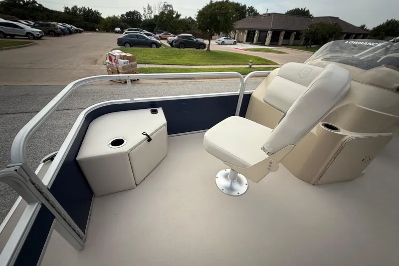 Slide: The Image of 2018 Sweetwater Sunrise 206 F pontoon boat on trailer, with Yamaha motor, parked on roadside. - 52