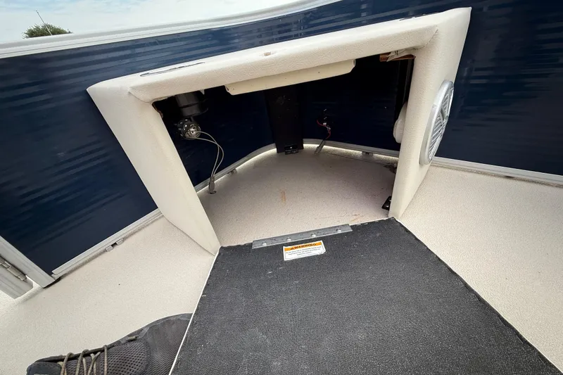 Slide: The Image of 2018 Sweetwater Sunrise 206 F pontoon boat on trailer, reflecting sky and surroundings. - 53