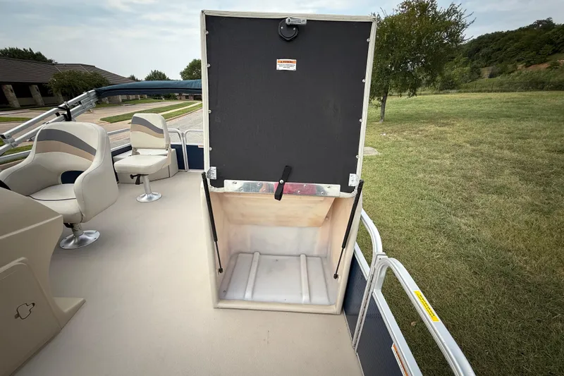 Slide: The Image of 2018 Sweetwater Sunrise 206 F boat, blue panel with "Sweetwater by Godfrey" logo. - 56