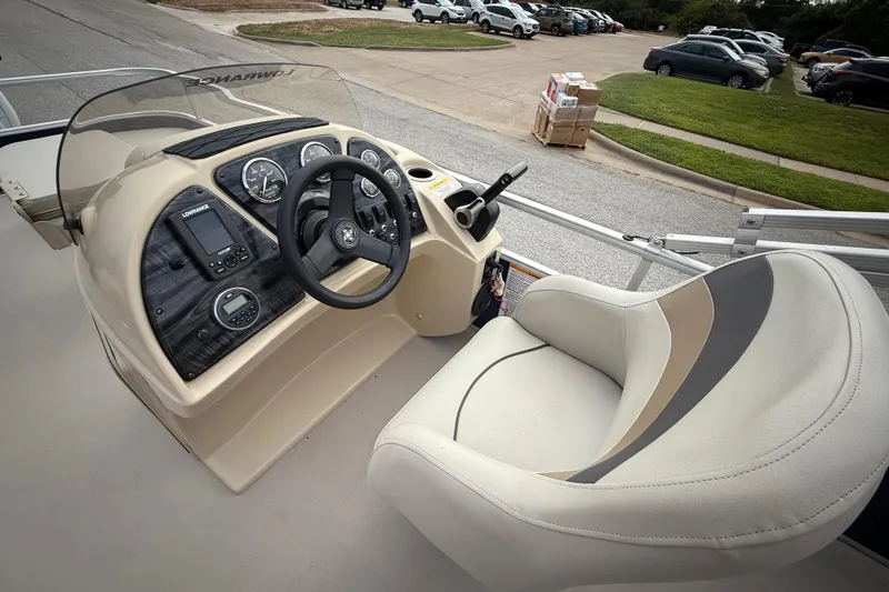 Slide: The Image of 2018 Sweetwater Sunrise 206 F boat trailer hitch connection on a paved road. - 60