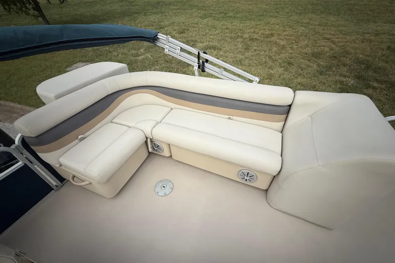 Slide: The Image of 2018 Sweetwater Sunrise 206 F pontoon boat interior with seating and railing. - 64